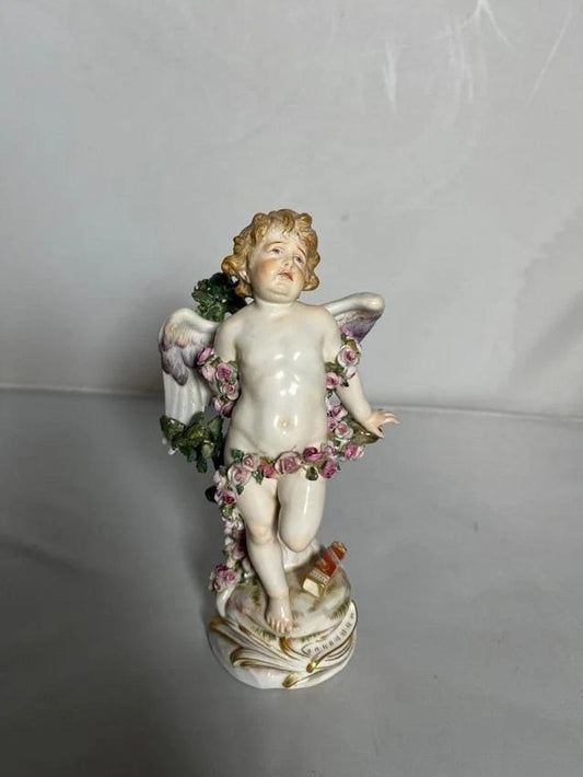 Antique Meissen Cupid bound by roses